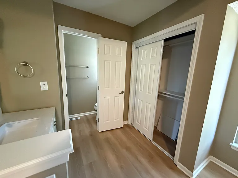 Primary bedroom bathroom area with second closet.