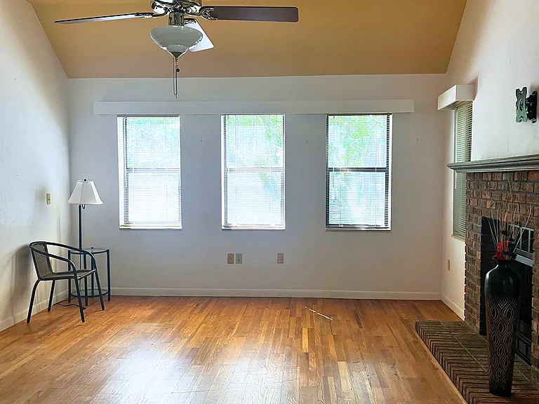 Living room has a total of 6 windows plus the sliding door