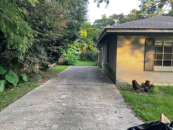 Additional extra long driveway on side of house