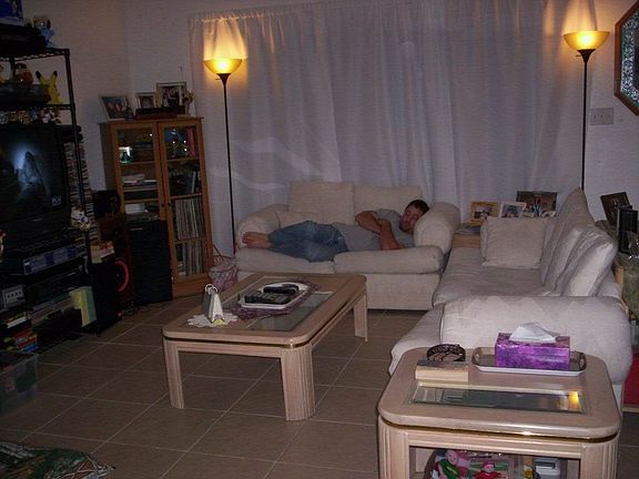 Living Room. Three large glass doors open up into lanai. Perfect for BBQ's!!