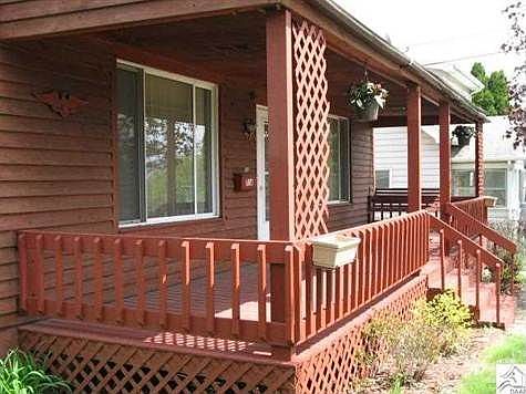 Hang your plants on this Charming Front Porch with comforting swing..