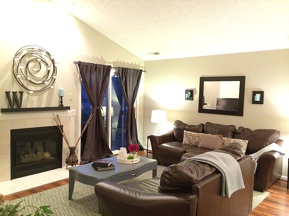 Living room, fireplace, vaulted ceilings and double door to