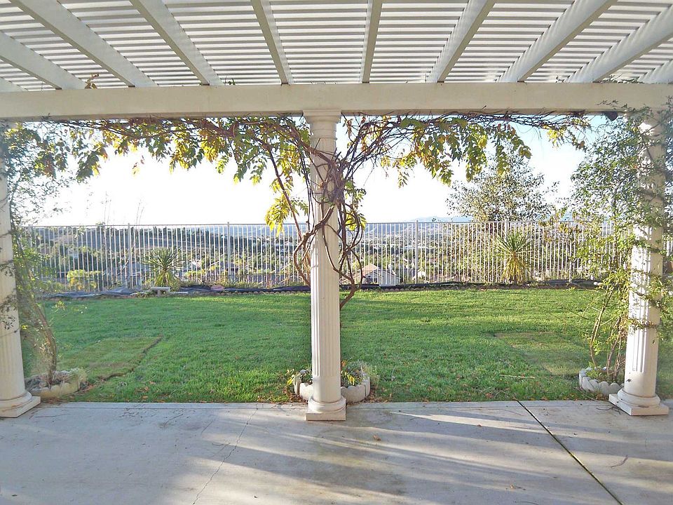 The rear yard has an open fence to enhance the view