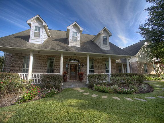 Another view of front elevation, dormers, incredible front porch.