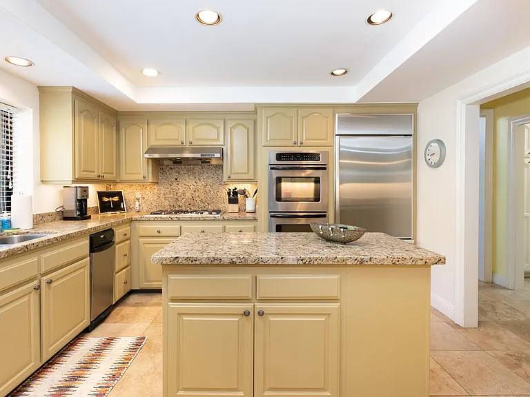 Well equipped kitchen with island counter.