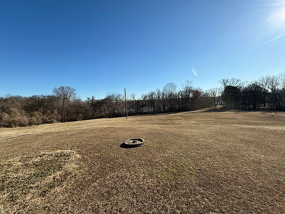 Property backs up to neighborhood common area. Lake views through treeline during the winter.