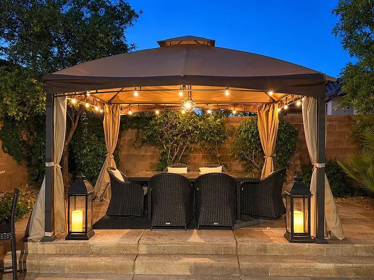Elevated covered outdoor dinning area with lighting