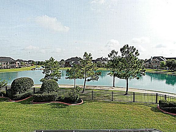 THIS STUNNING HOME BOASTS INCREDIBLE LAKE VIEWS THROUGHOUT.