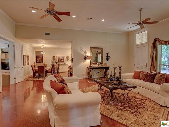 Living Room view into dining and kitchen.  Great-looking floors! High ceilings and crown molding throughout!