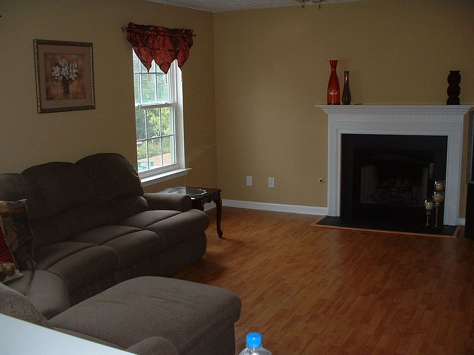 Family Room with cozy fireplace, new floors and new paint