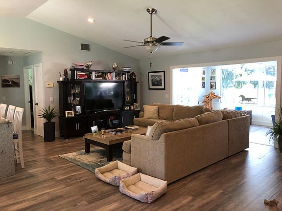 Open floor plan- living room with view to Florida room and backyard.