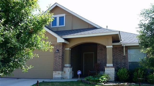 Charming well-maintained home with welcoming covered front porch.