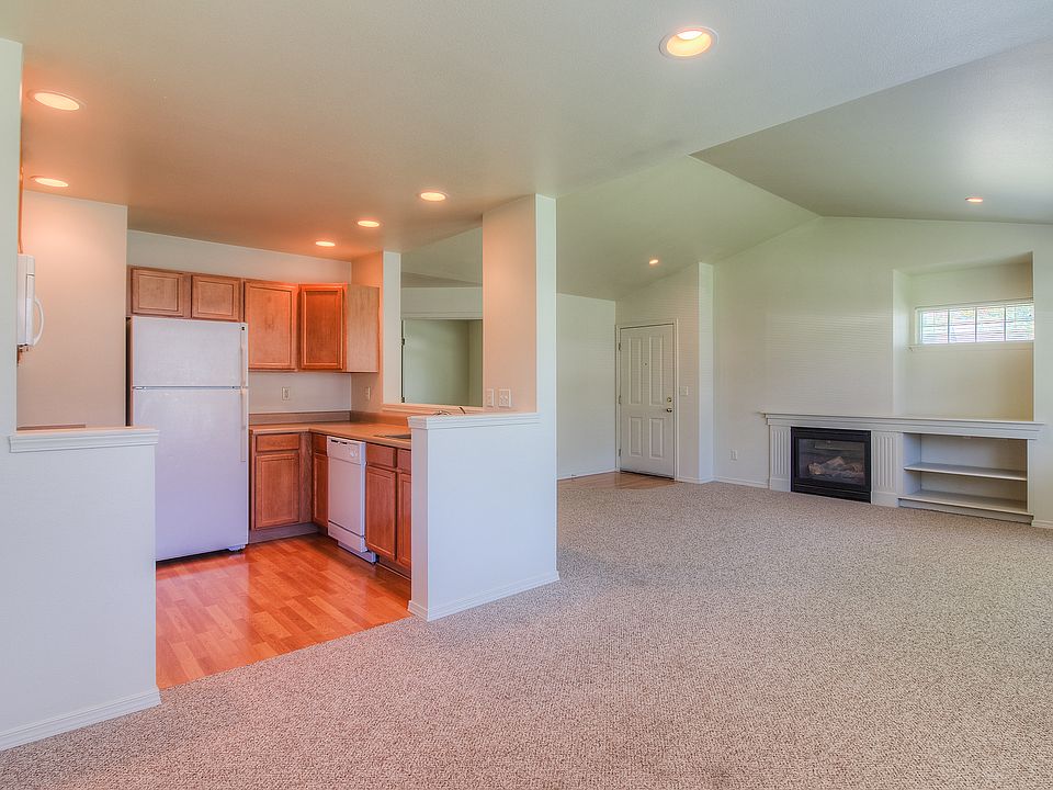 single story kitchen and living room view from dining area