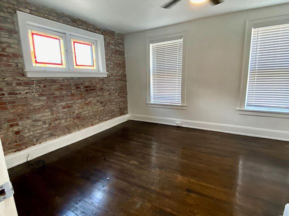 Bedroom #1 with exposed brick