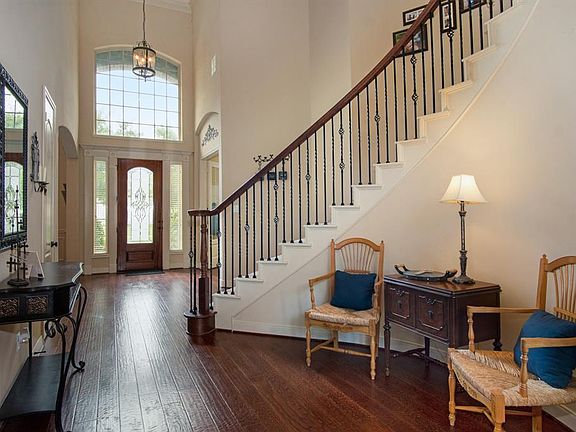 Another view of the foyer with the formal dining room and the study at the front of the home.