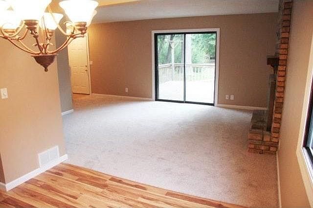 Living Room with fireplace and walkout to private deck