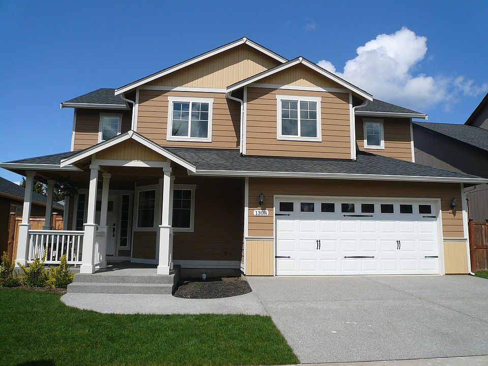 Great look, covered porch, washed aggregate, lawn