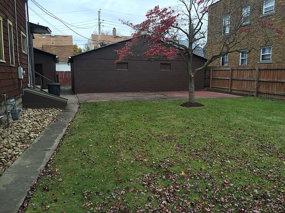 Fenced Side Yard w/ 2Garages