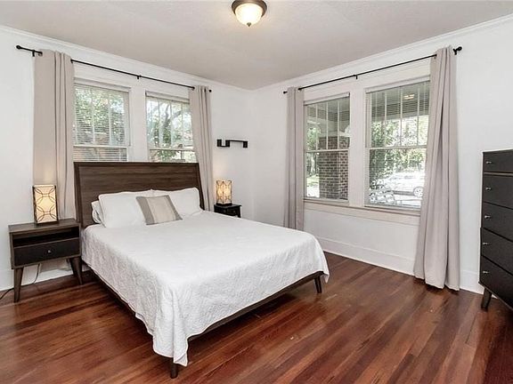 Bedroom featuring dark hardwood / wood-style floors