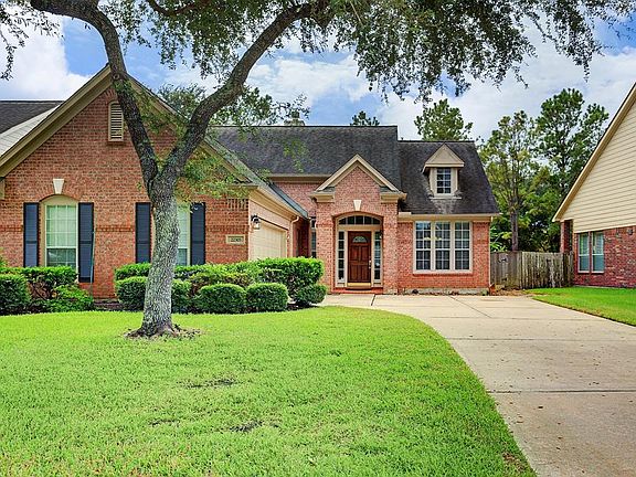 This extra long driveway is big enough to fit extra cars or to watch the kids play outside.