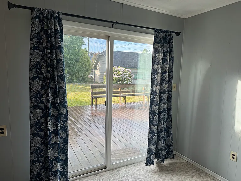 This 4th bedroom has been opened to the kitchen so would work well for a bonus room, craft room or office and boasts a slider to the back deck. BBQ anyone?