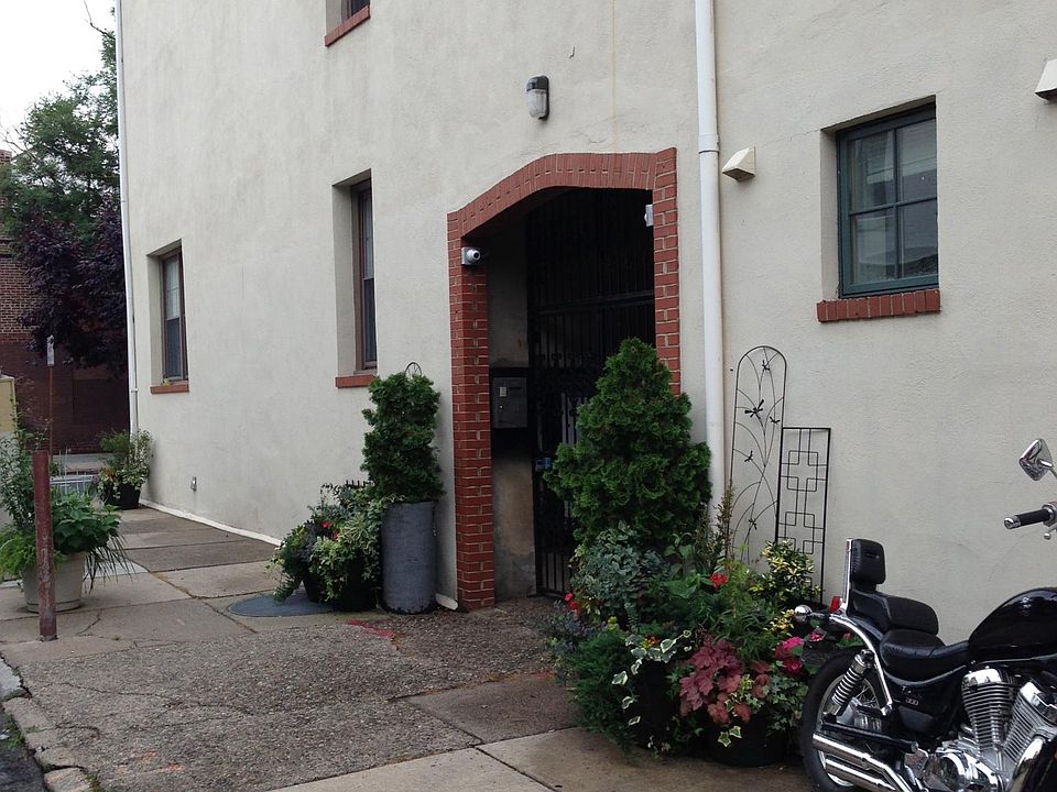 Private entrance to gated courtyard off of Naudain St