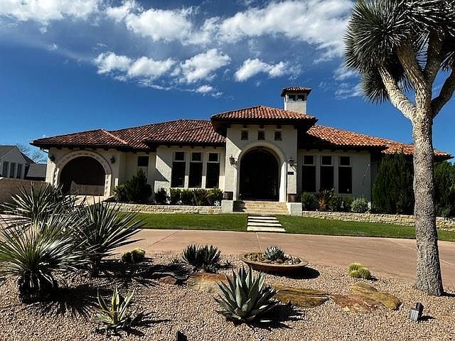 Front of house, One car garage up top, two car garage downstairs.