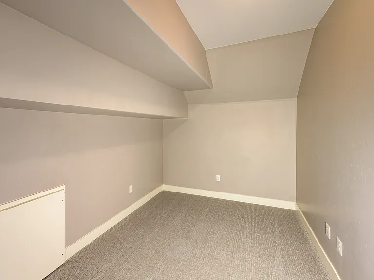 Upstairs end of hall game room / extra storage space
