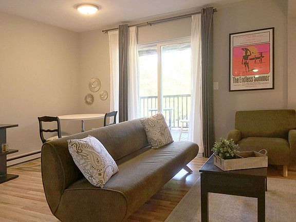 Living room and dining area looking onto covered deck