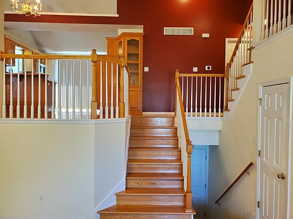 Stairs from Great Room up to main level. Stairs going down to family room (basement)