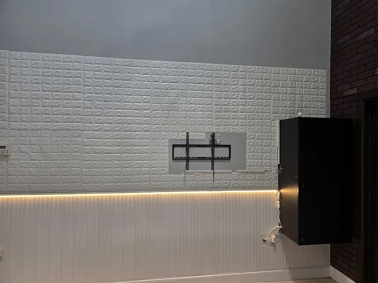 High ceiling Living room with pre installed TV wall mount, Cabinets(hides out all electronics & wires), wall panel & Accent lights.