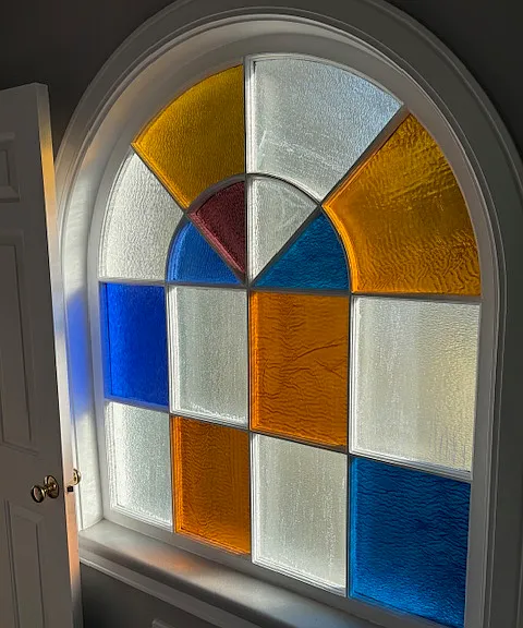 Original stained glass window in bathroom.
