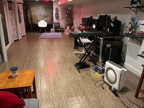 Huge basement that extends beyond curtain and camera view