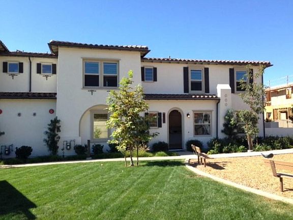 Front door opens to common picnic area and playscape