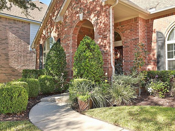 Picturesque curved entryway, Weatherproof outlets, 2016 full roof replacement, mature landscape, gutters. Exterior hose bibbs.