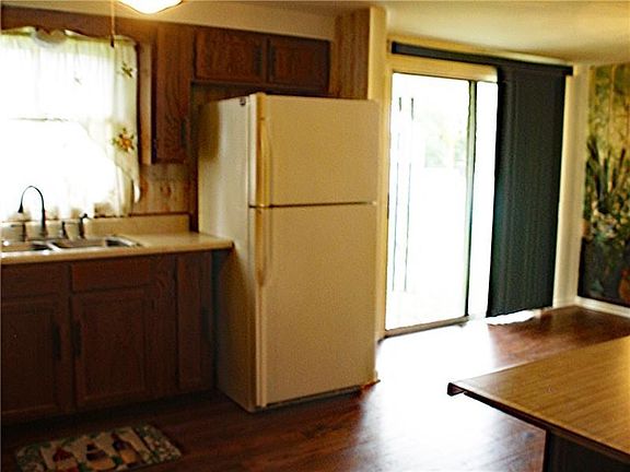 Kitchen opens to fenced back yard.