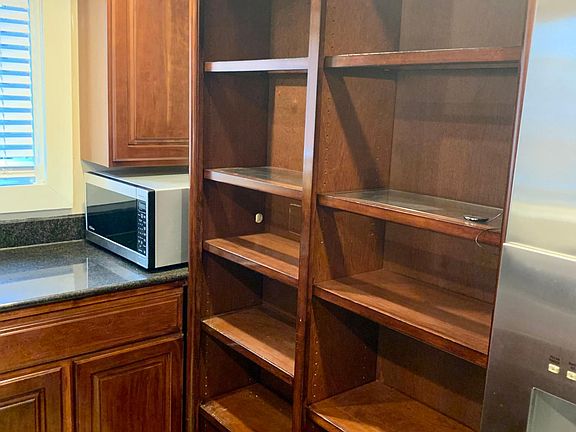 Main Floor Kitchen with ample counter space, shelving, and cabinetry. A chef's dream!