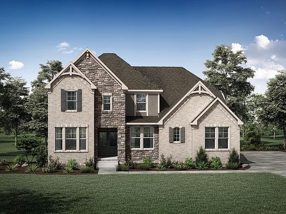 custom home with brick, stucco and stone