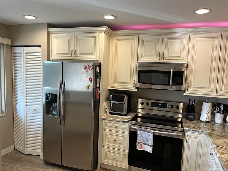 Updated kitchen with stainless steel appliances.
