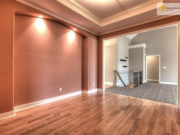Formal dining room with wood floors