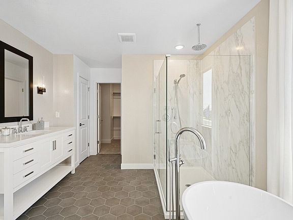 Primary bath with glass shower enclosure