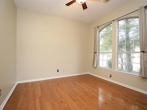 The study, home office is off the front and offers wood floors and French doors for privacy.