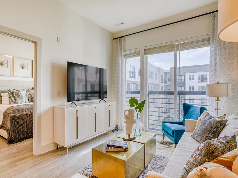 Floor to ceiling windows and open concept floorplans create an inviting space.