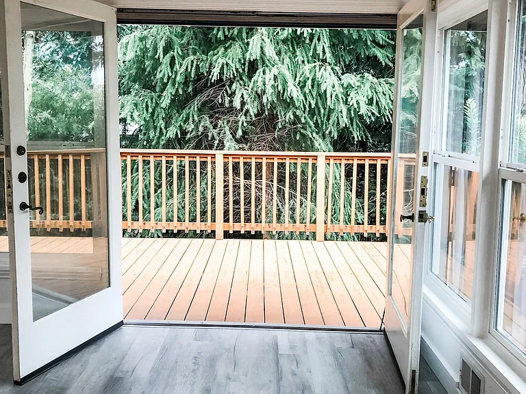 French doors open up to private deck with peek a boo views of sound. Beautiful for BBQs and entertaining.