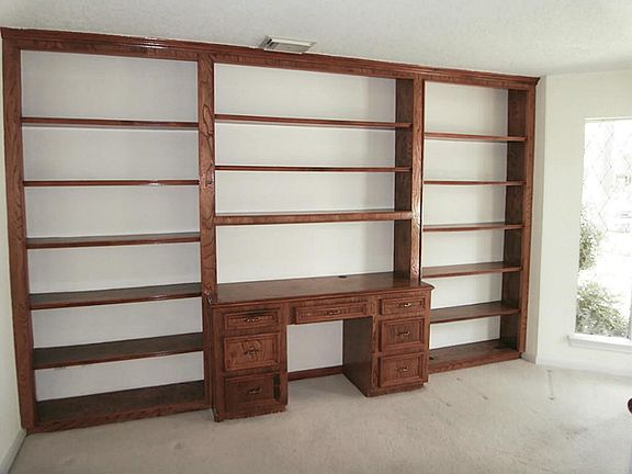 NICE STUDY WITH BUILTIN BOOKSHELVES AND BEVELED WINDOWS