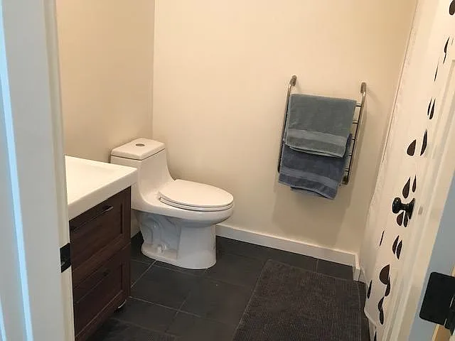 Basement ensuite bathroom with heated towel rail