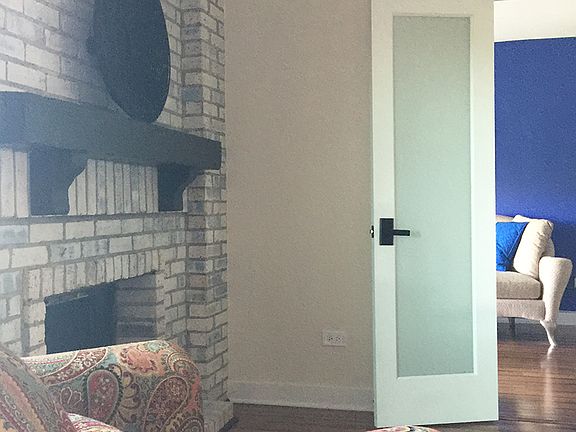 Gas log white-wash fireplace