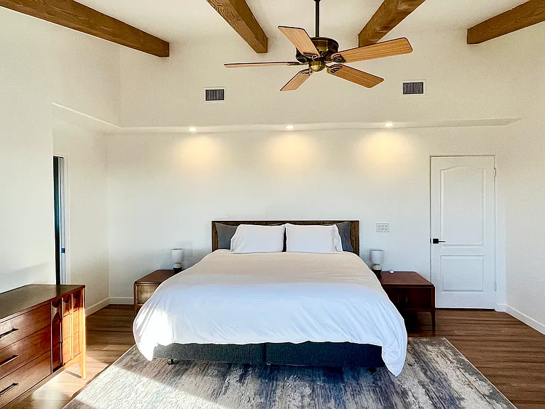 Alternative view of primary bedroom. Bed featured is a king bed.