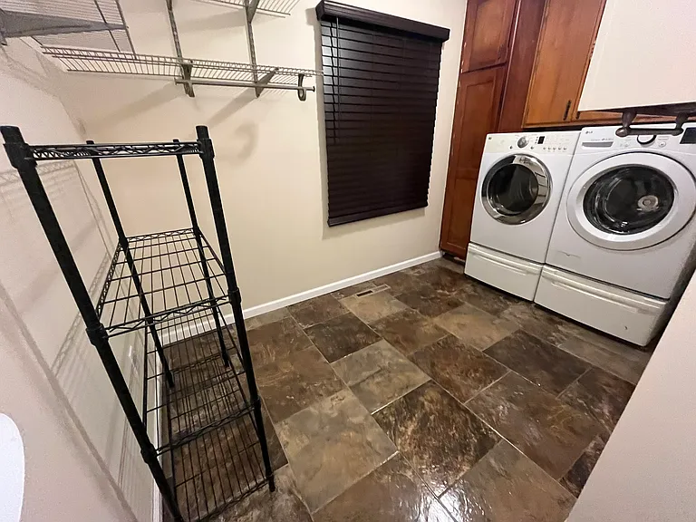 Spacious Laundry Room and pantry - NEW Washing machine and matching used but perfect Dryer - Both on Pedestals for easy load and use. New blinds - lots of utility cabinets.