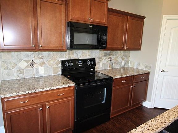 Includes stove, microwave, refrigerator with water & ice, an